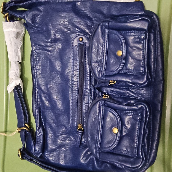 Convertible crossbody backpack in navy blue